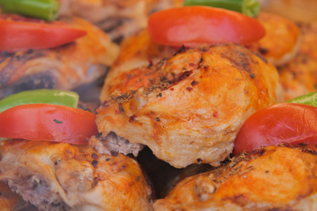 Delicious grilled chicken with fresh vegetables on display