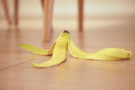 Banana peel left on the floor in a casual indoor settingの写真素材