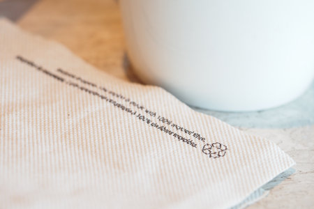 Napkin with eco-friendly message at a local cafeの写真素材