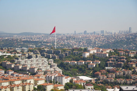 City view of urban landscape with Turkish flag on hillの写真素材