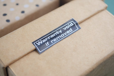 Warranty sticker on package indicating legal terms