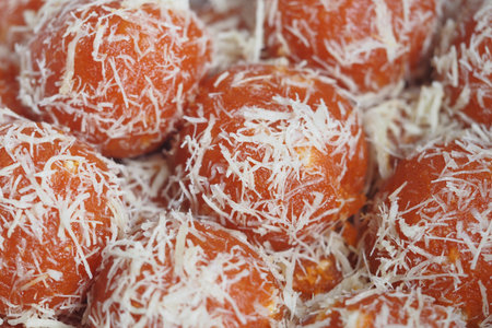 Festive colorful coconut sweets on displayの写真素材