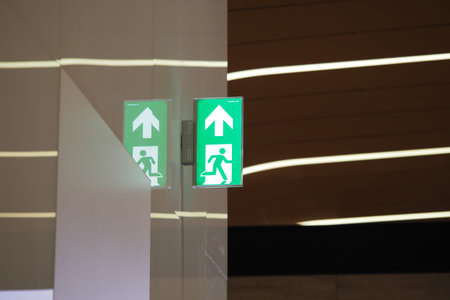 Emergency exit sign illuminated in a modern interior