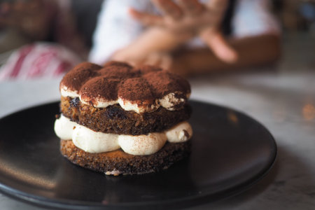 Delicious dessert pastry served on a black plate