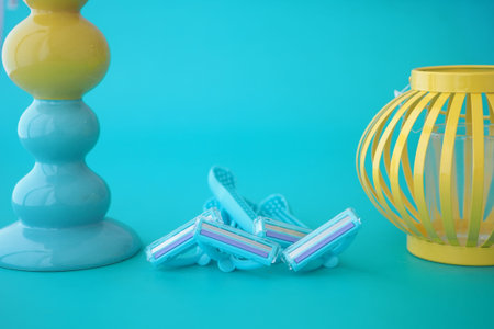 Colorful shaving razors next to decorative lamp and lanternの写真素材