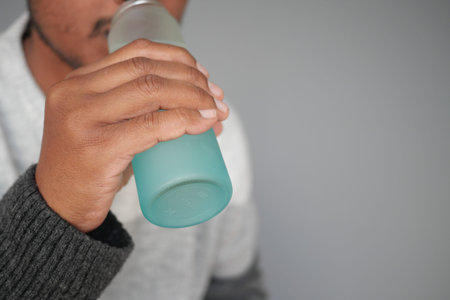 Man enjoying a refreshing drinkの写真素材