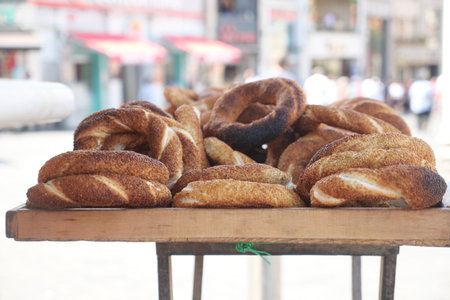 Freshly baked turkish simit on display at market stall