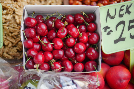 Fresh cherries displayed at a local market stand