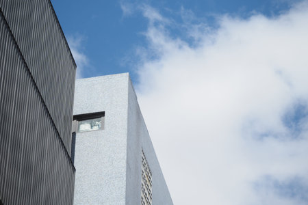 Modern architecture against a blue sky with clouds