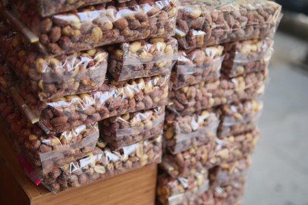 Nuts stacked in bags at a market stall in the evening