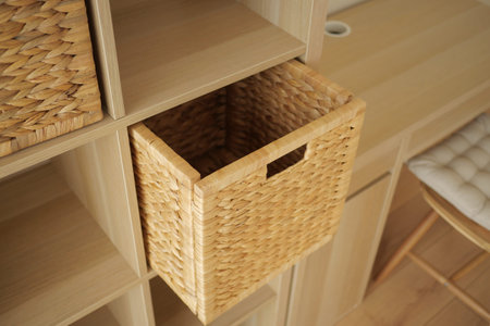 Natural woven storage basket in modern shelving unit