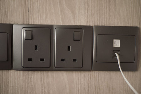 Electric sockets installed on a modern wall