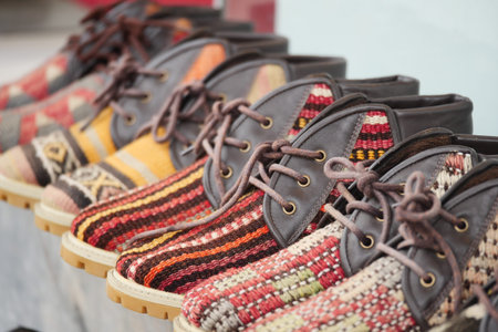 Colorful handmade shoes displayed at a market stall