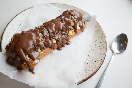 Delicious dessert with chocolate topping and nuts served