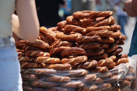 Freshly baked turkish simit sold at outdoor market gathering