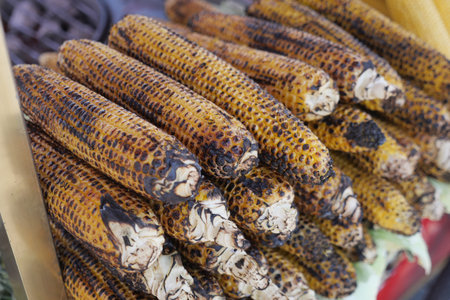 Grilled corn cobs at a local market in summer