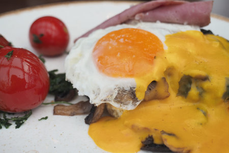 Delicious breakfast plate with eggs and tomatoes served