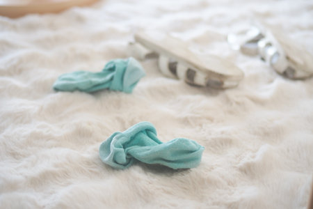 Soft blue socks on a cozy rugの写真素材