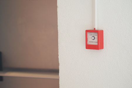 Fire alarm device mounted on wall in office interiorの写真素材
