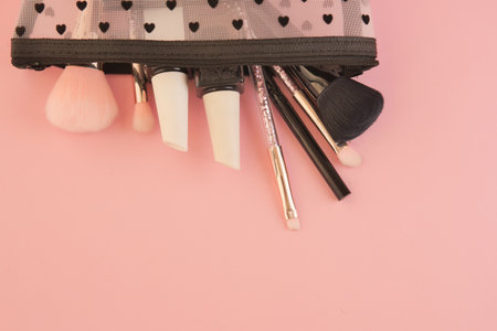 Brushes and tools arranged neatly in a cosmetic bagの写真素材