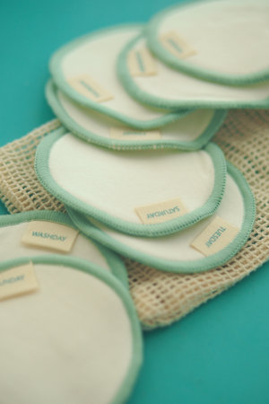 Soft nursing pads on a turquoise backgroundの写真素材