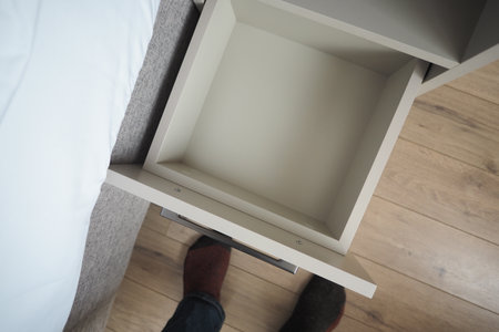 Nightstand drawer open with no items insideの写真素材