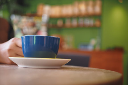 Enjoying a warm beverage in a cozy cafe setting