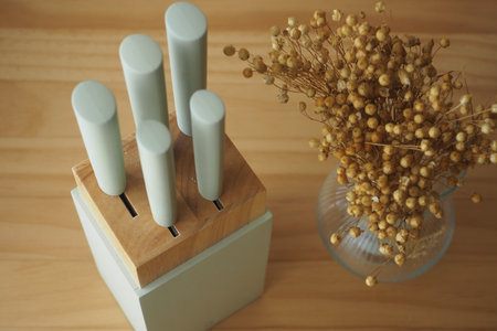 Stylish kitchen knife block with dried flowers centerpieceの写真素材