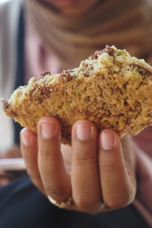 woman hand holding a cookie