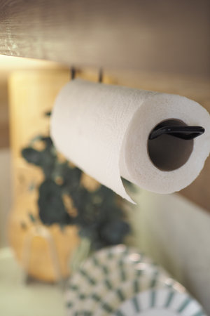 Kitchen details featuring a roll of paper towels on a holderの写真素材