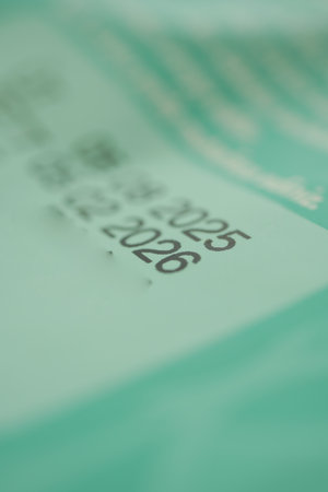 expire dates printed on a green food packetの写真素材