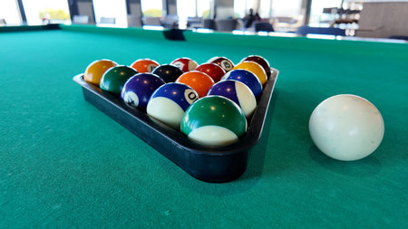 Pool balls set up for a game in a modern lounge