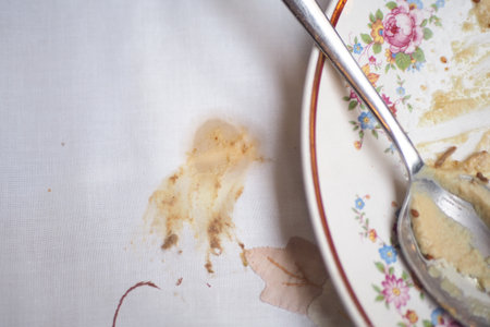 food spilled on a floral patterned tableclothの写真素材