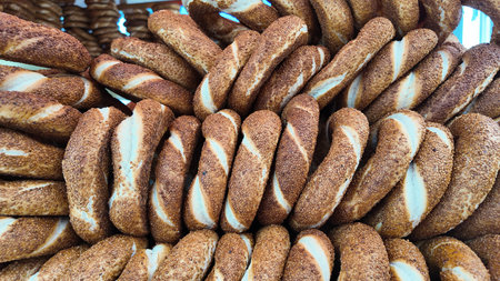 Delicious simit stacked in a vibrant market setting