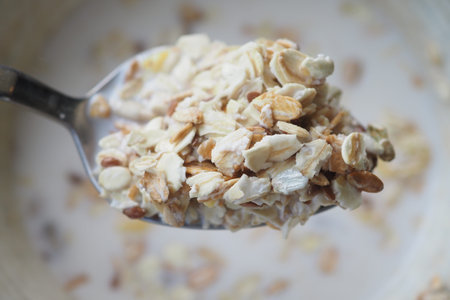 Healthy breakfast option featuring oats on a spoon