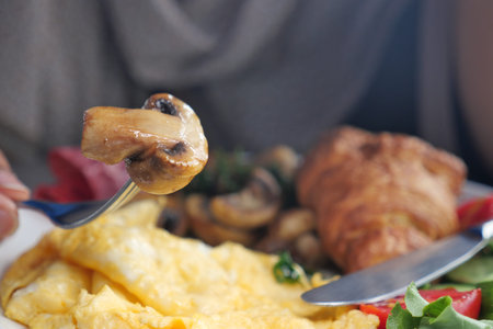 Enjoying a delicious breakfast with mushrooms and eggs