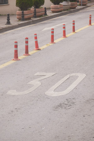Traffic cones marking speed limit on urban street