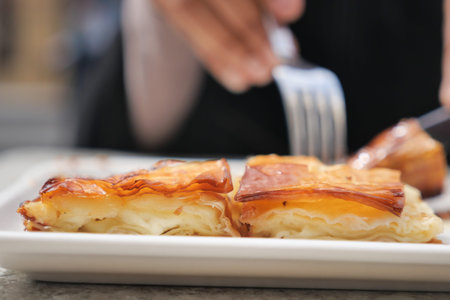 Delicious pastry served with fork in a casual setting