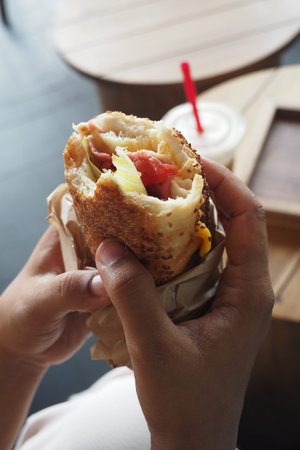 Delicious wrap in hand at a casual eatery