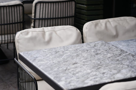 Outdoor seating area with modern furniture at cafe