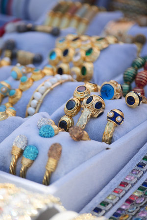 Collection of colorful rings and jewelry on displayの写真素材