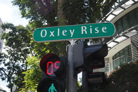 Singapore, orchard road 5 march 2025. Oxley Rise street sign with traffic light in urban area