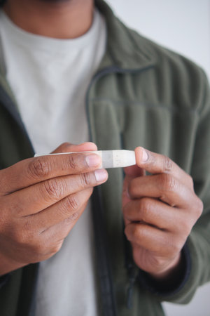 closeup of a man hand measuring diabeticの写真素材