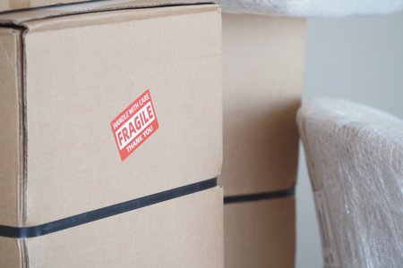 Shipping boxes ready for delivery with fragile stickersの写真素材