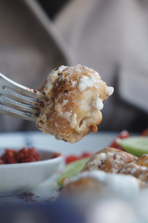 Delicious dumpling served with dipping sauceの写真素材