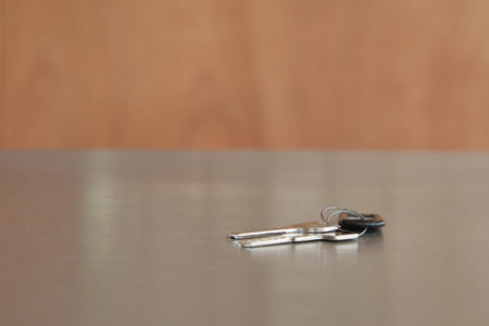 Keys resting on a table in a simple indoor settingの写真素材