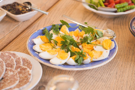 Freshly prepared egg salad on a dining tableの写真素材