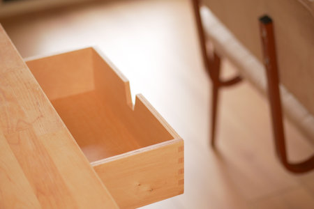 Minimalist wooden drawer in a modern workspace settingの写真素材