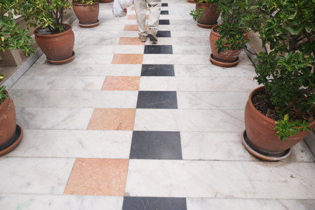 Walking along a patterned marble pathway in a garden