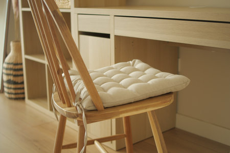 Comfortable chair with cushion in home office setupの写真素材